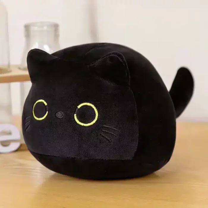 Cojín de peluche de gato negro con ojos grandes